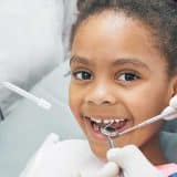 child smiling visiting route 66 smiles family dentistry