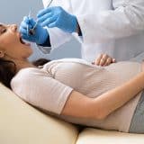 pregnant woman visiting the dentist